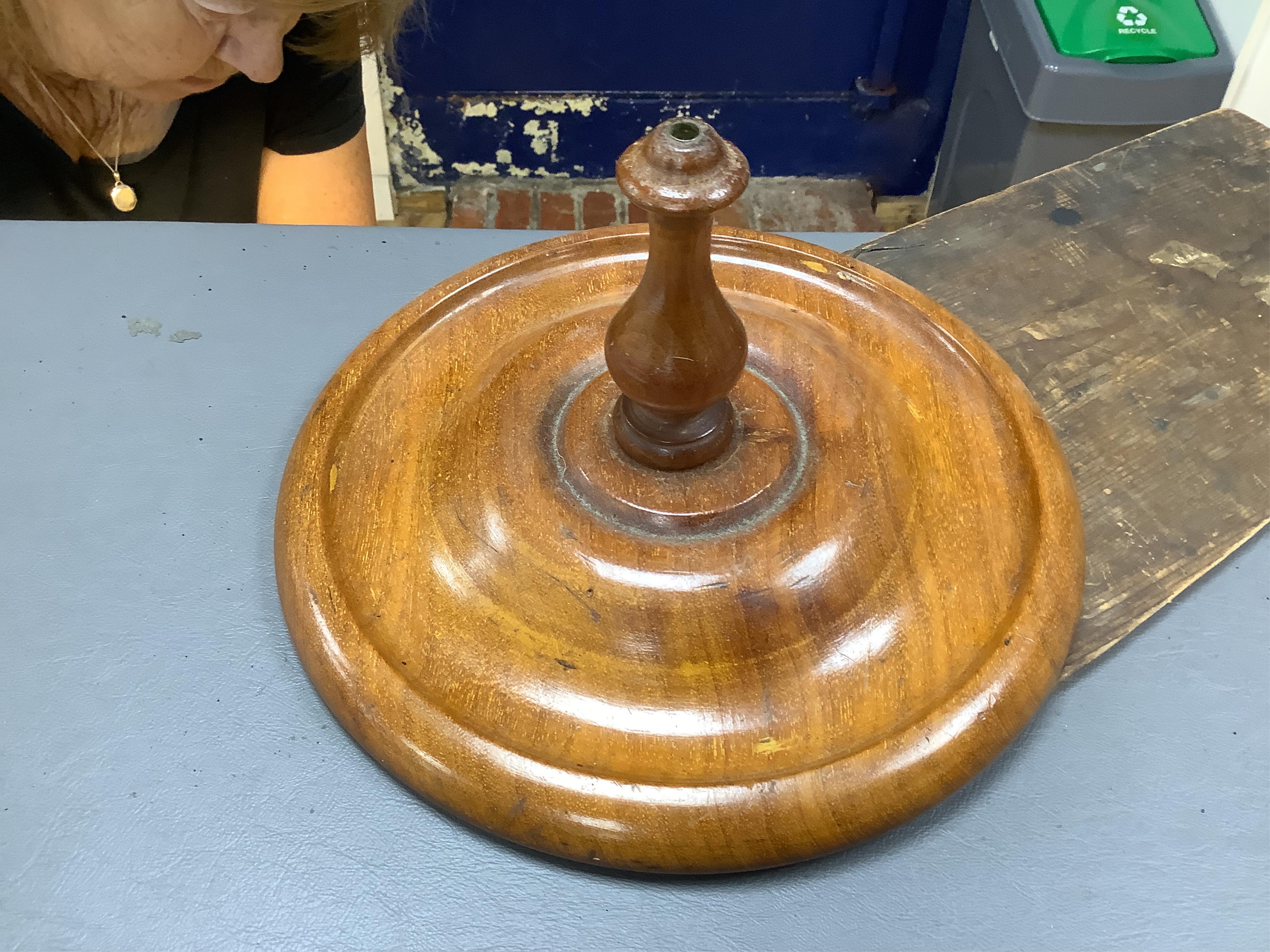 A late 19th century painted tin and mahogany zoetrope by the London Stereoscopic Co. with a number of paper inserts, diameter 30cm